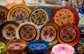Closeup shot of colorful decorative plates for a sale in a market