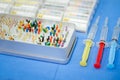 Closeup shot of a colorful endodontics kit and syringes
