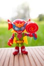 Closeup shot of a colorful figurine toy sitting on a wooden surface