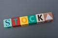 Closeup shot of colorful letter blocks forming the word stock - stock market finance concept Royalty Free Stock Photo