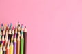 Closeup shot of colorful pencils on a pink background Royalty Free Stock Photo