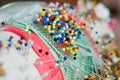 Closeup shot of colorful pinheads on a traditional bobbin lace making tool Royalty Free Stock Photo