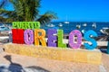 Closeup shot of the colorful word Puerto Moreloson the seashore on a bright day in Mexico Royalty Free Stock Photo