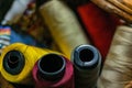 Closeup shot of colorful yarn rolls in a woven basket Royalty Free Stock Photo