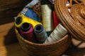 Closeup shot of colorful yarn rolls in a woven basket Royalty Free Stock Photo