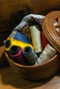 Closeup shot of colorful yarn rolls in a woven basket Royalty Free Stock Photo