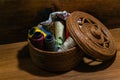 Closeup shot of colorful yarn rolls in a woven basket Royalty Free Stock Photo