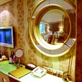 Closeup shot of a console mirror in an illuminated hotel room Royalty Free Stock Photo