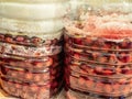 Closeup shot of containers of sour cherries with sugar, preparing sour cherry brandy Royalty Free Stock Photo