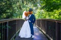 Closeup shot of a couple with pumpkins on their heads marrying with each other