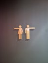 Closeup shot of a creative pointing toilet sign Royalty Free Stock Photo