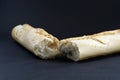 Closeup shot of a cut baguette on a black surface