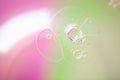 Closeup shot of cute bubble formations with rainbow-colored background Royalty Free Stock Photo