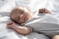 Closeup Shot Of Cute Lovely Newborn Baby Sleeping On Bed Royalty Free Stock Photo