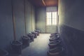 Closeup shot of Dachau concentration camp toilets in Germany Royalty Free Stock Photo