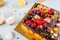 Closeup shot of a delicious chocolate cake decorated with fruits Royalty Free Stock Photo