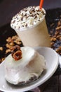 Closeup shot of the delicious creamy pastry with a cup of frappuccino with whipped cream