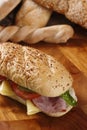 Closeup shot of a delicious sandwich with ham, cheese, tomatoes and lettuce Royalty Free Stock Photo