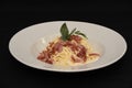 Closeup shot of delicious spaghetti carbonara isolated on black background Royalty Free Stock Photo