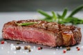 Closeup shot of a beef steak with peppercorns and herbs on a plate Royalty Free Stock Photo