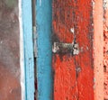 Closeup shot of a detail of an old painted wooden door Royalty Free Stock Photo