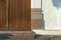 Closeup shot of a detail of wooden door and stone wall