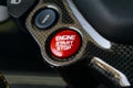 Closeup shot of details on an engine start and stop button in a Ferrari 488 GTB car