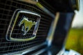 Closeup shot of details on the exterior of a vintage blue Ford Mustang sports car