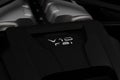 Closeup shot of the details of a modern Bentley Bentayga 2022 Hybrid badge