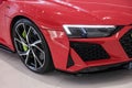 Closeup shot of the details of modern Red Audi R8 Sport Plus in the showroom