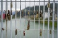 Closeup shot of differently sized padlocks hanging on a fence