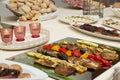 Closeup shot of a dining table full of different kinds of assorted food Royalty Free Stock Photo