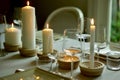 Closeup shot of a dinner table with wine glasses and candles with a blurred background