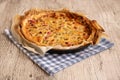 Closeup shot of a dish of homemade rhubarb pie on a blue kitchen cloth