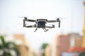 Closeup shot of a DJI Mavic Mini 2 drone on the blurry background