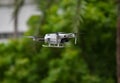 Closeup shot of a DJI Mavic Mini 2 drone on the blurry background