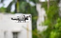 Closeup shot of a DJI Mavic Mini 2 drone on the blurry background