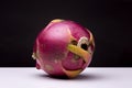 Closeup shot of a dragon fruit on a white surface with a black background Royalty Free Stock Photo