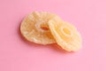 Closeup shot of the dried pineapple slices isolated on a pink background Royalty Free Stock Photo