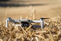 Closeup shot of a Drone Mavic mini from Dji in a dry field