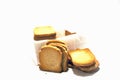 Closeup shot of dry bread slices under the lights isolated on a white background Royalty Free Stock Photo