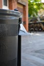 Closeup shot of a dustbin in the street full of face masks during the coronavirus Royalty Free Stock Photo