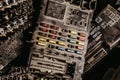 Closeup shot of a dusty plastic electronics cover with buttons of different colors