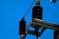 Closeup shot of an electrical power cable line and fuse in the pole