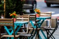 Closeup shot of an empty tables with empty chairs at a local outdoor resturant