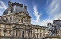 Closeup shot of the equestrian statue of Louis XIV by Bernini and the Louvre Museum in Paris Royalty Free Stock Photo