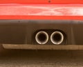 Closeup shot of the exhaust red F-type Jaguar luxury car