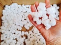 Closeup shot of expanded polystyrene chips in someone's hand for shipping Royalty Free Stock Photo
