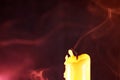 Closeup shot of an extinguished candle on a dark background Royalty Free Stock Photo
