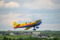 Closeup shot of a Extra EA-300 airplane model flying at Hangariada aeronautical festival show